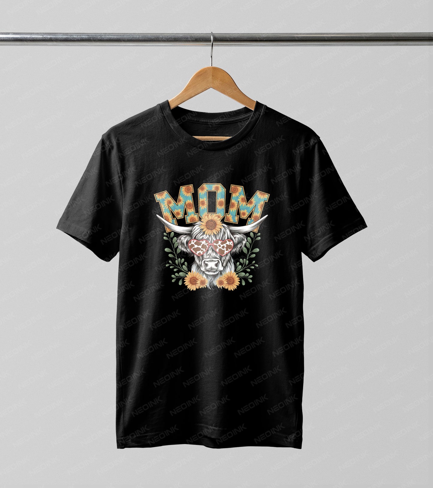 Western style highland cow wearing heart sunglasses and surrounded by sunflowers, easily applied using DTF transfers that come ready to print for trendy country outfits.