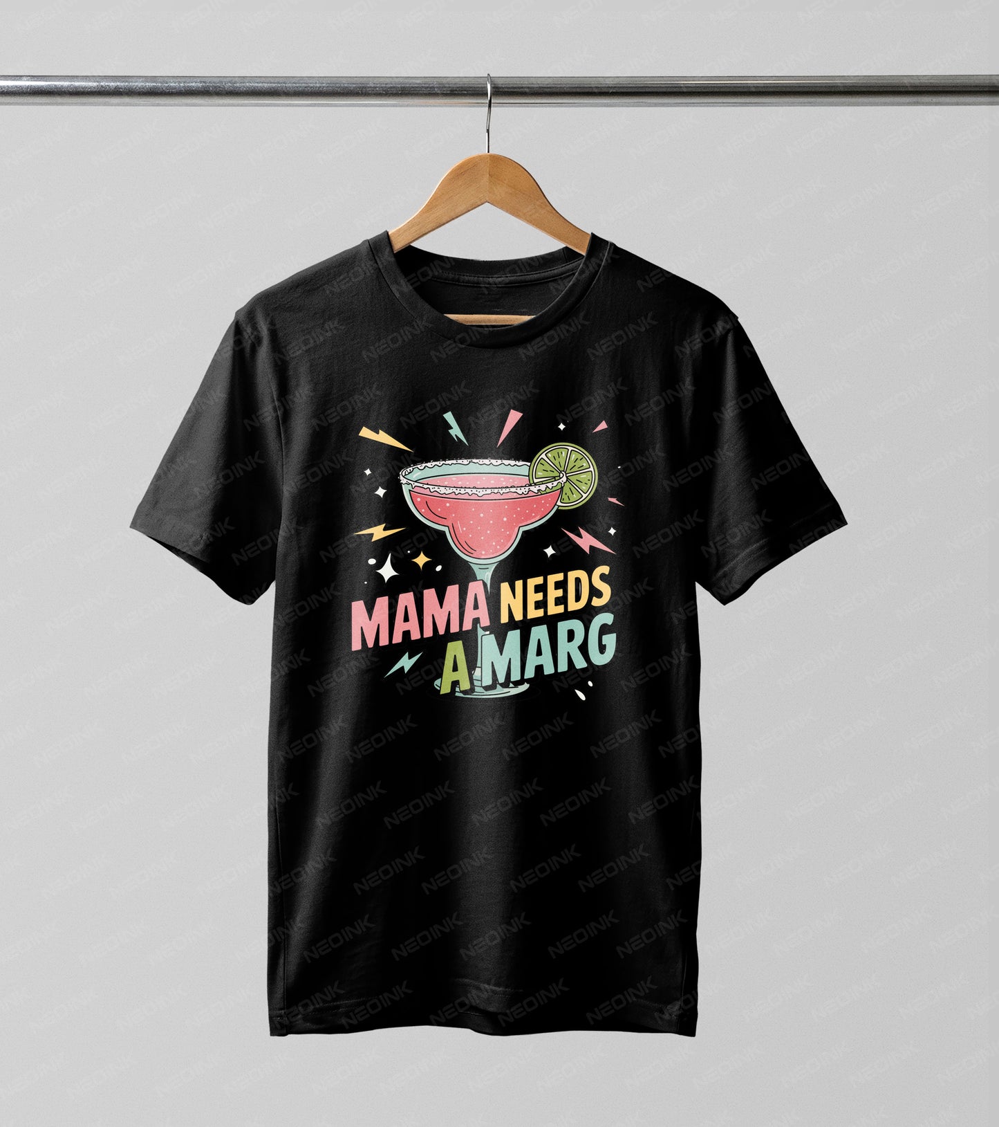 Playful 90s retro graphic featuring a pink margarita glass and "Mama Needs A Marg" text, utilizing premium DTF transfers so they arrive ready to print on your favorite party tops.