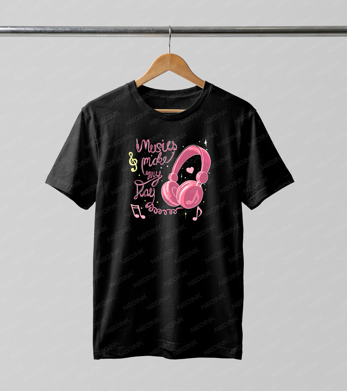 Cute pink headphones surrounded by musical notes and playful typography, available as premium DTF transfers ready to print on dark colored apparel.