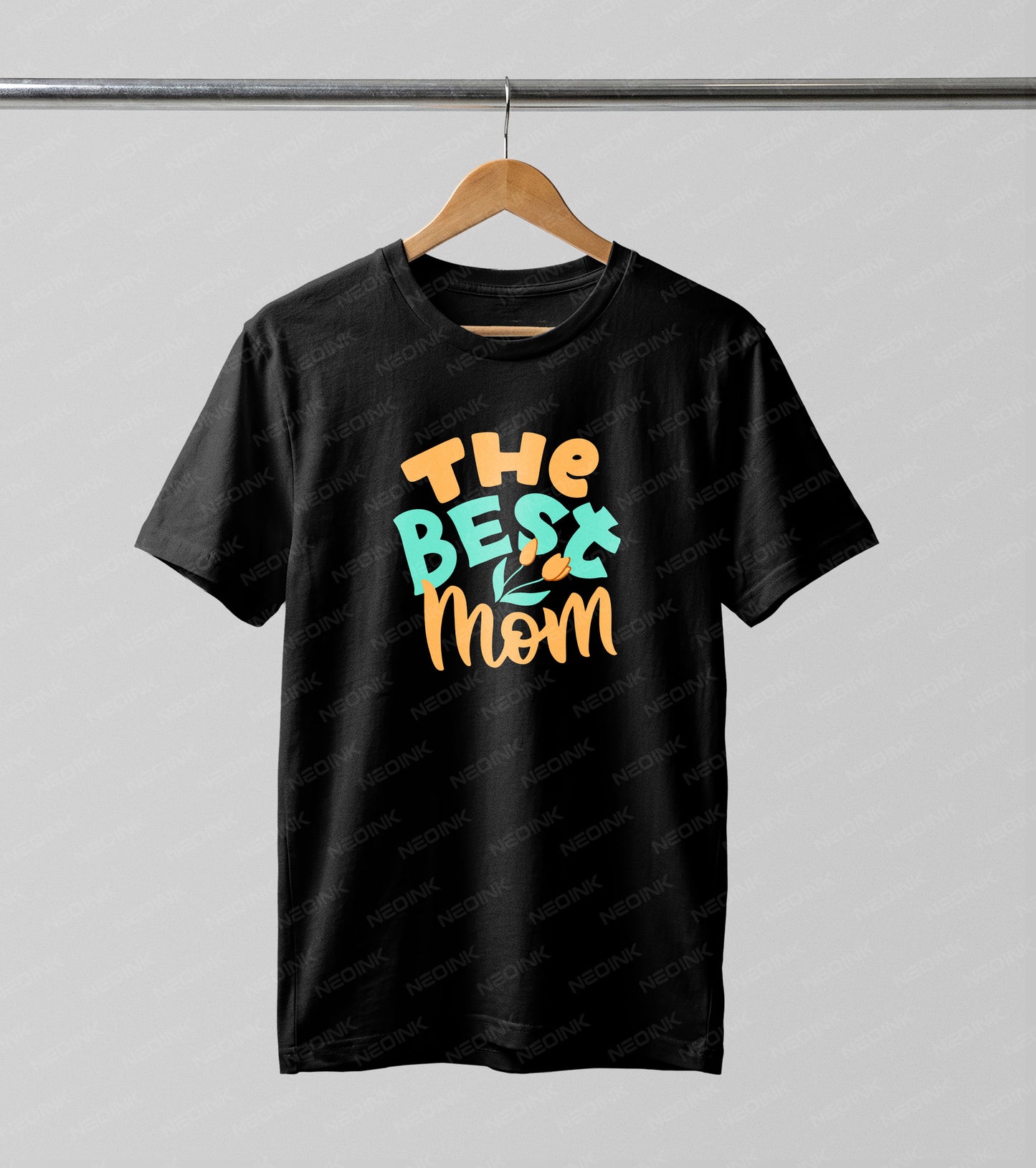 Colorful teal and orange retro bubble letters spelling "The Best Mom" with tulips, making these bright DTF transfers ready to print for cheerful spring t-shirts.