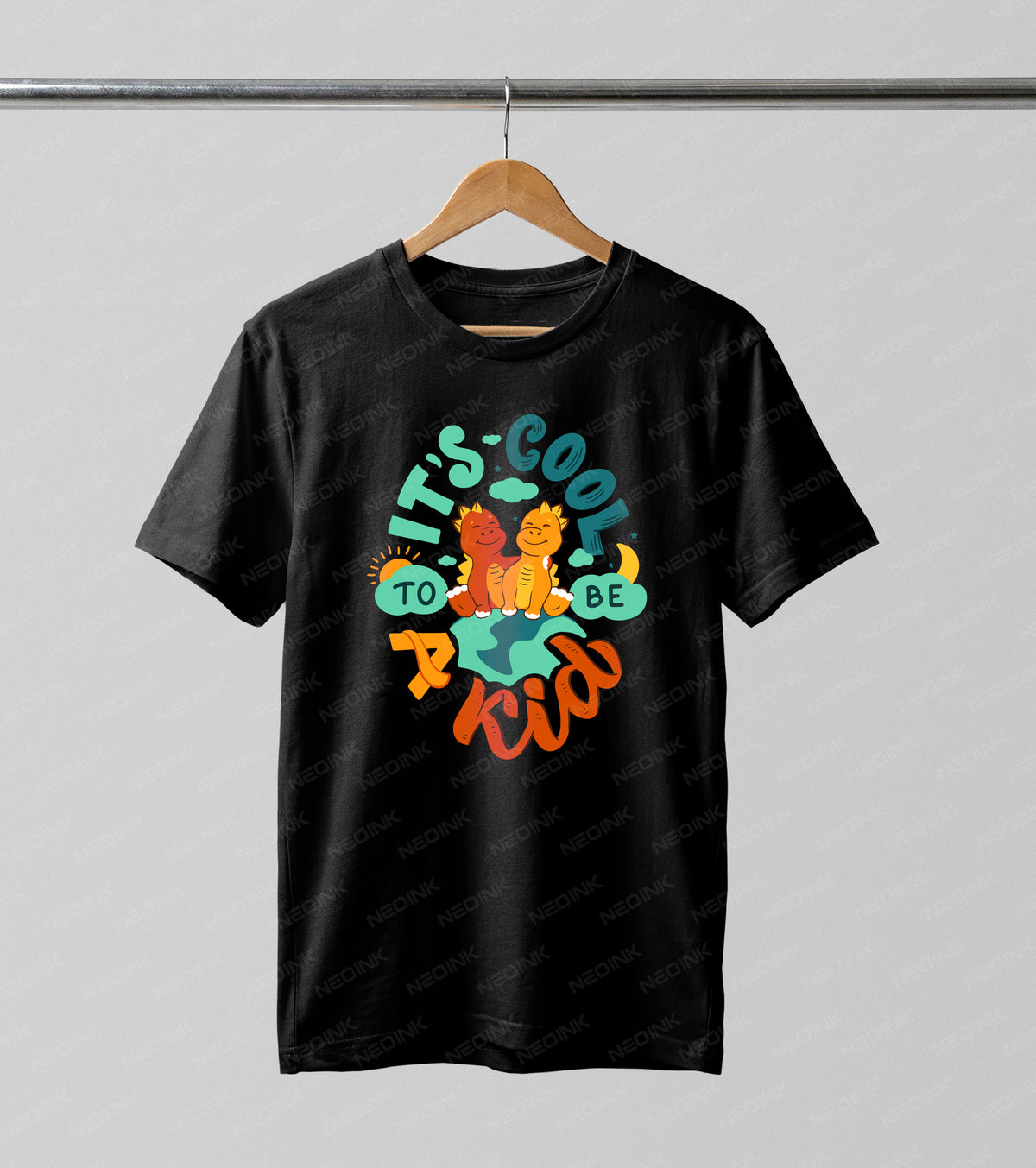 Cute baby dinosaurs sitting on planet earth with retro typography, offered as high-quality DTF transfers ready to print for colorful youth apparel.