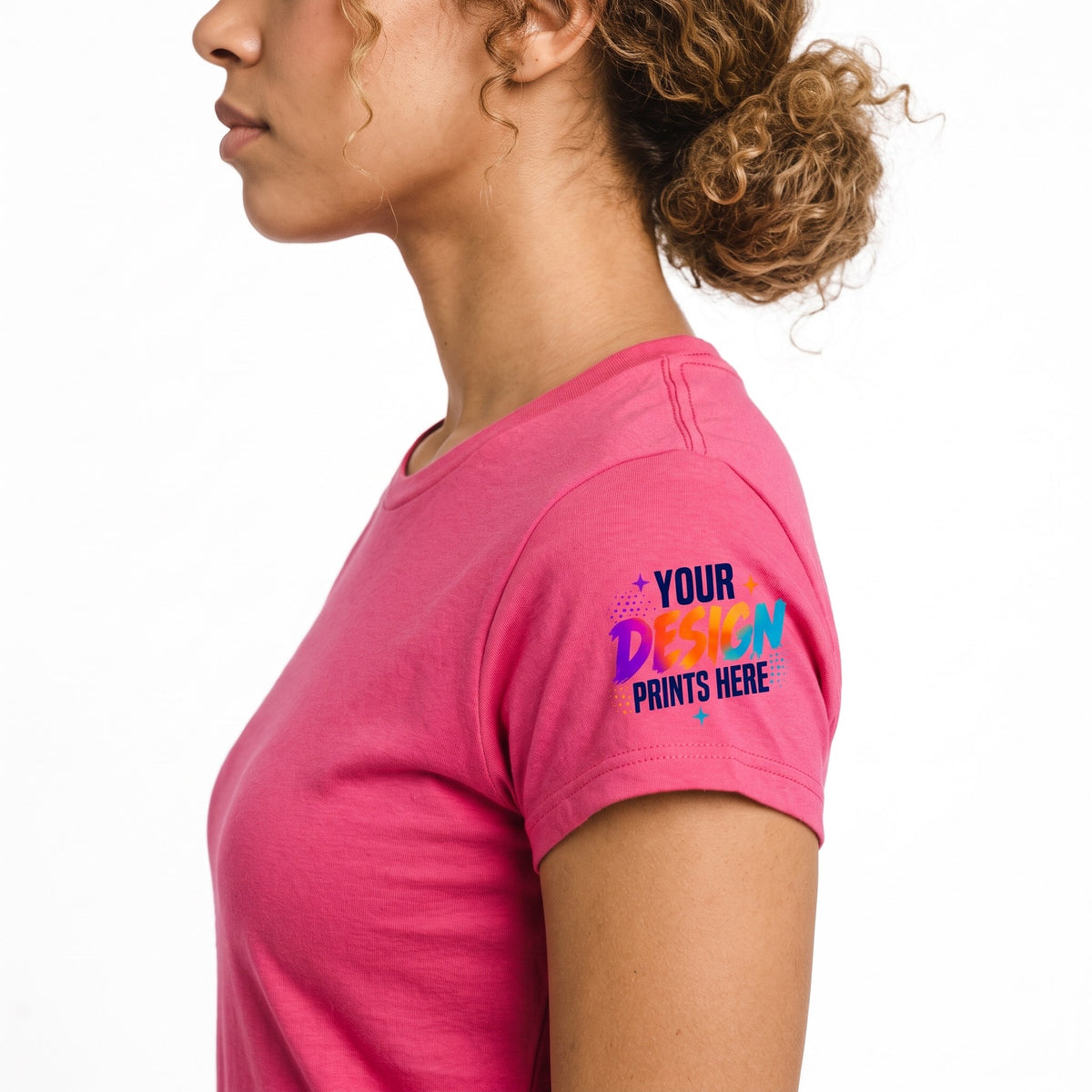Close-up of a small custom sleeve print on a pink women’s t-shirt