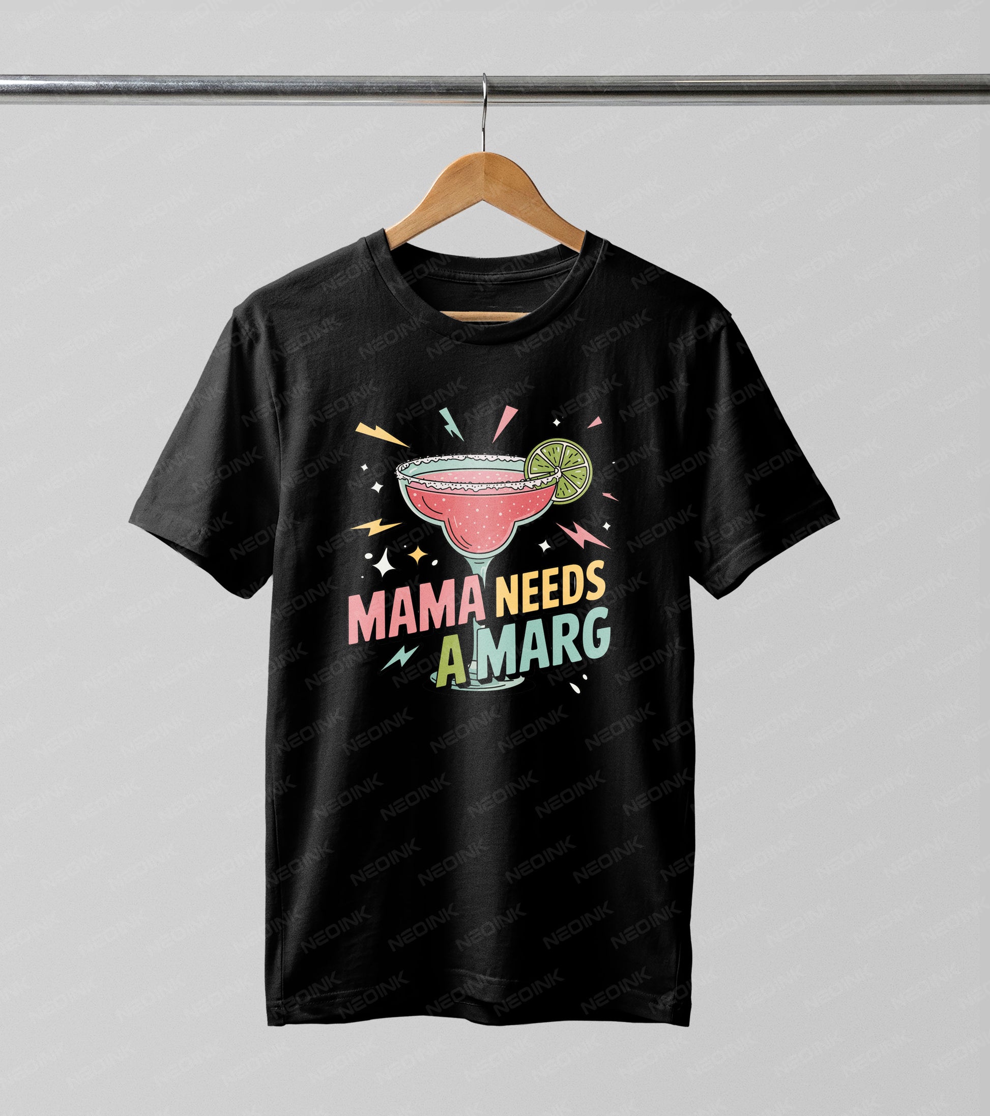 Playful 90s retro graphic featuring a pink margarita glass and "Mama Needs A Marg" text, utilizing premium DTF transfers so they arrive ready to print on your favorite party tops.