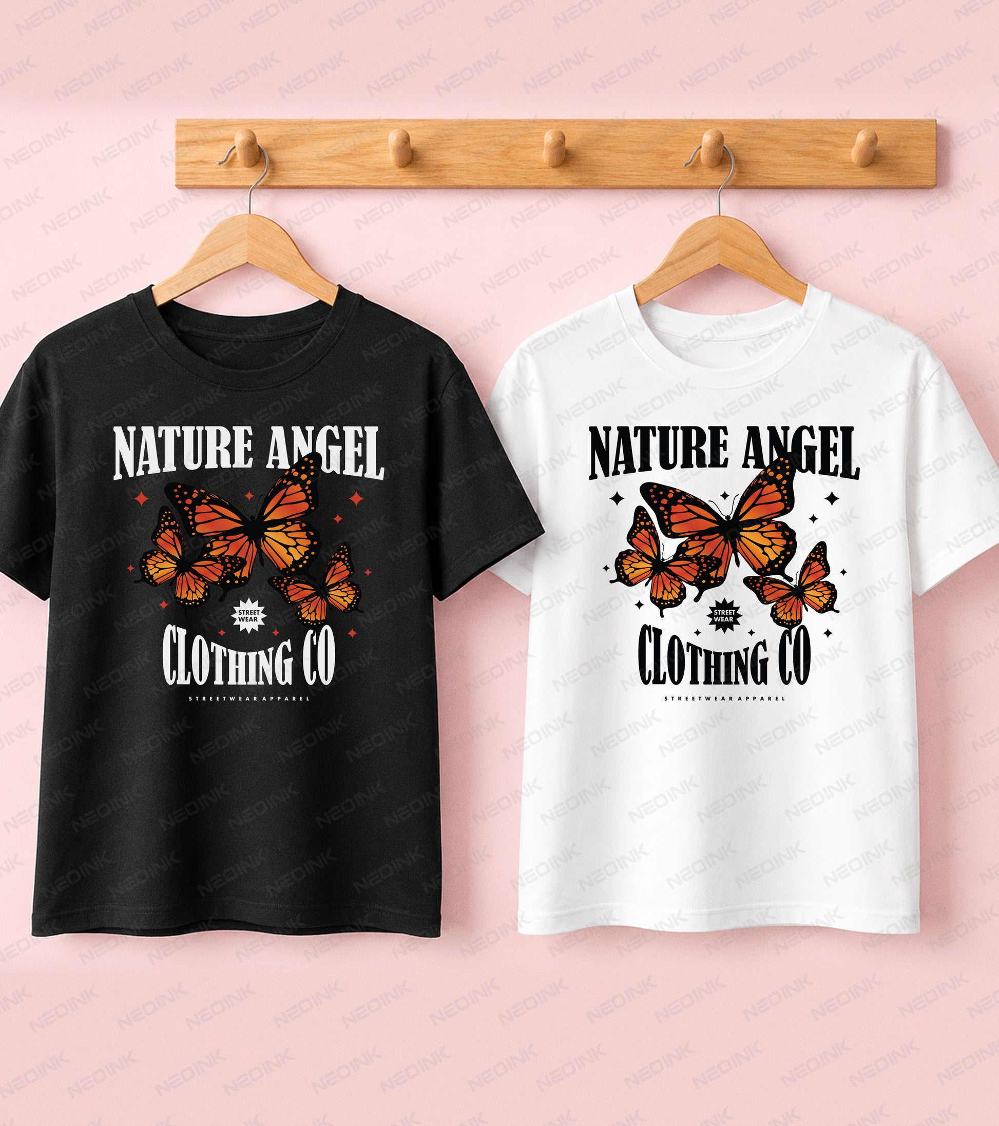 Black t-shirt showcasing bright orange monarch butterflies and Nature Angel text for a positive Good Vibes streetwear aesthetic.