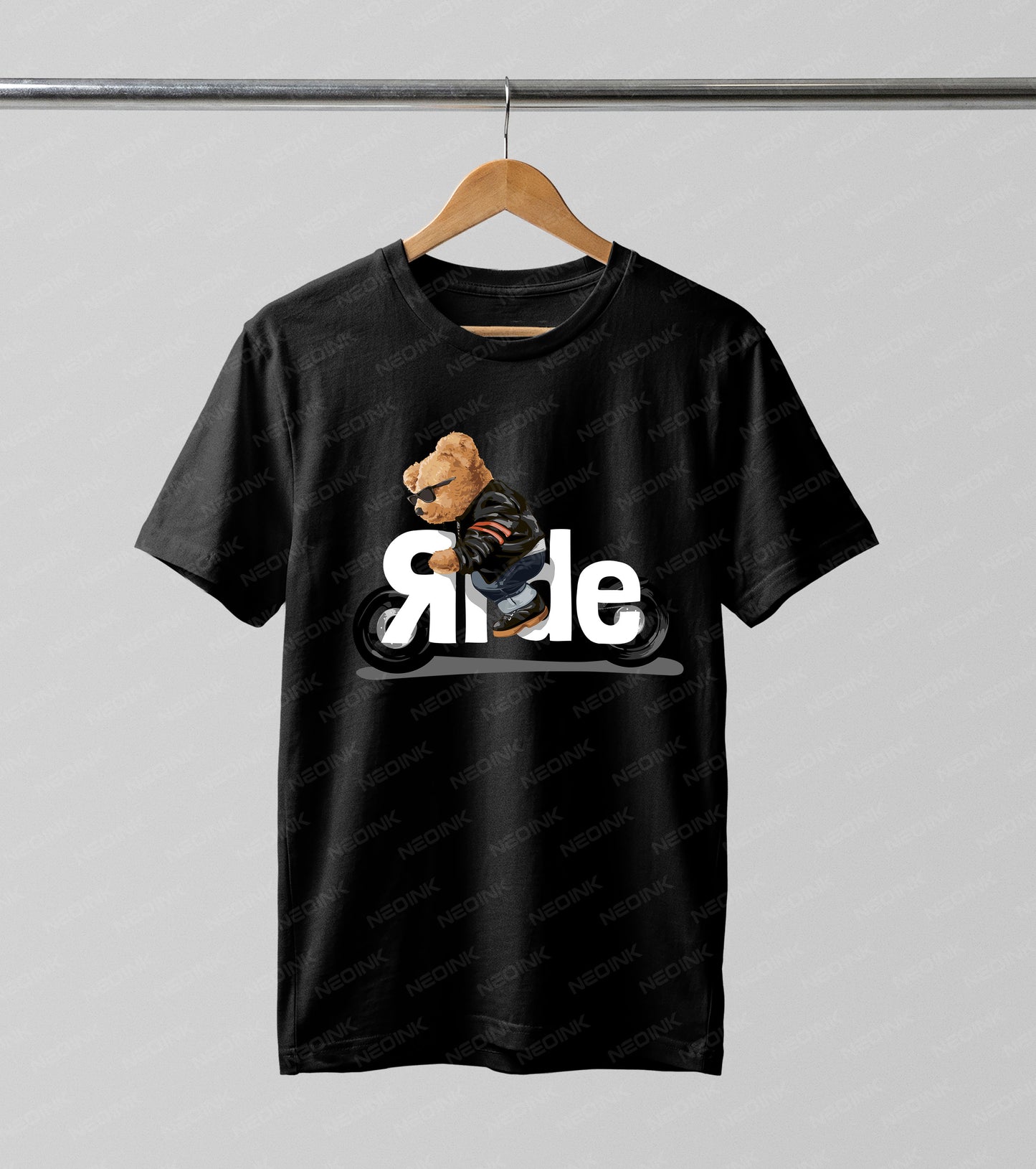 Badass teddy bear in a leather jacket riding a motorcycle, provided as vivid DTF transfers completely ready to print on black casual wear.
