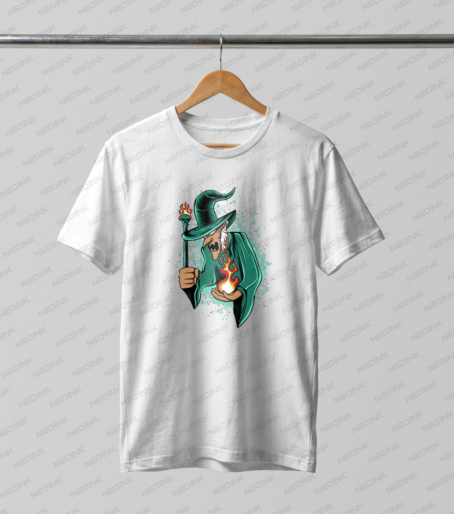 vibrant spellcasting green witch DTF transfer. Specially designed to pop on light-colored apparel, this graphic features a wicked witch with a classic pointed hat and flowing green cloak, wielding a blazing skull staff and conjuring a magical fireball against a subtle teal splatter background.