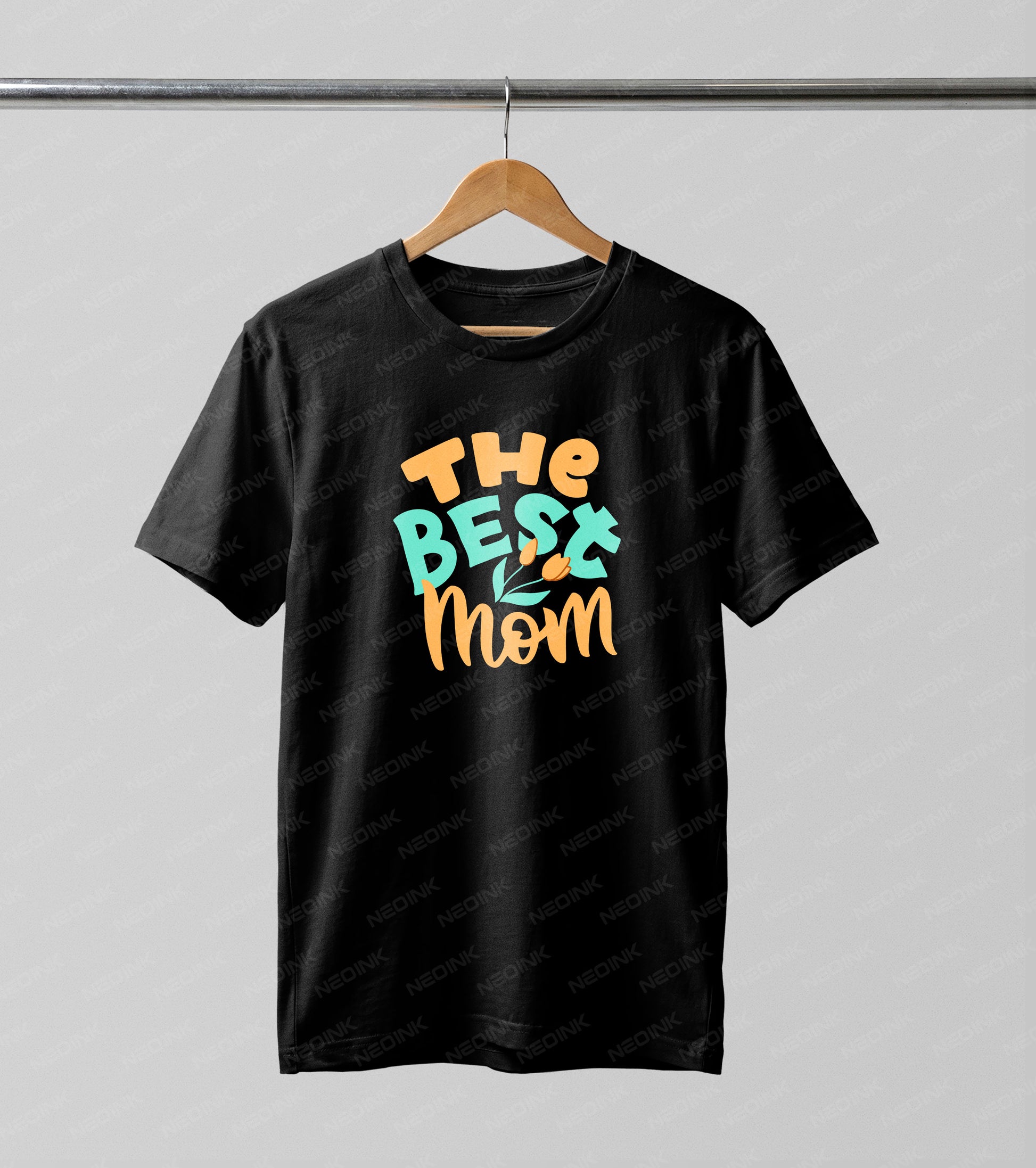 Colorful teal and orange retro bubble letters spelling "The Best Mom" with tulips, making these bright DTF transfers ready to print for cheerful spring t-shirts.