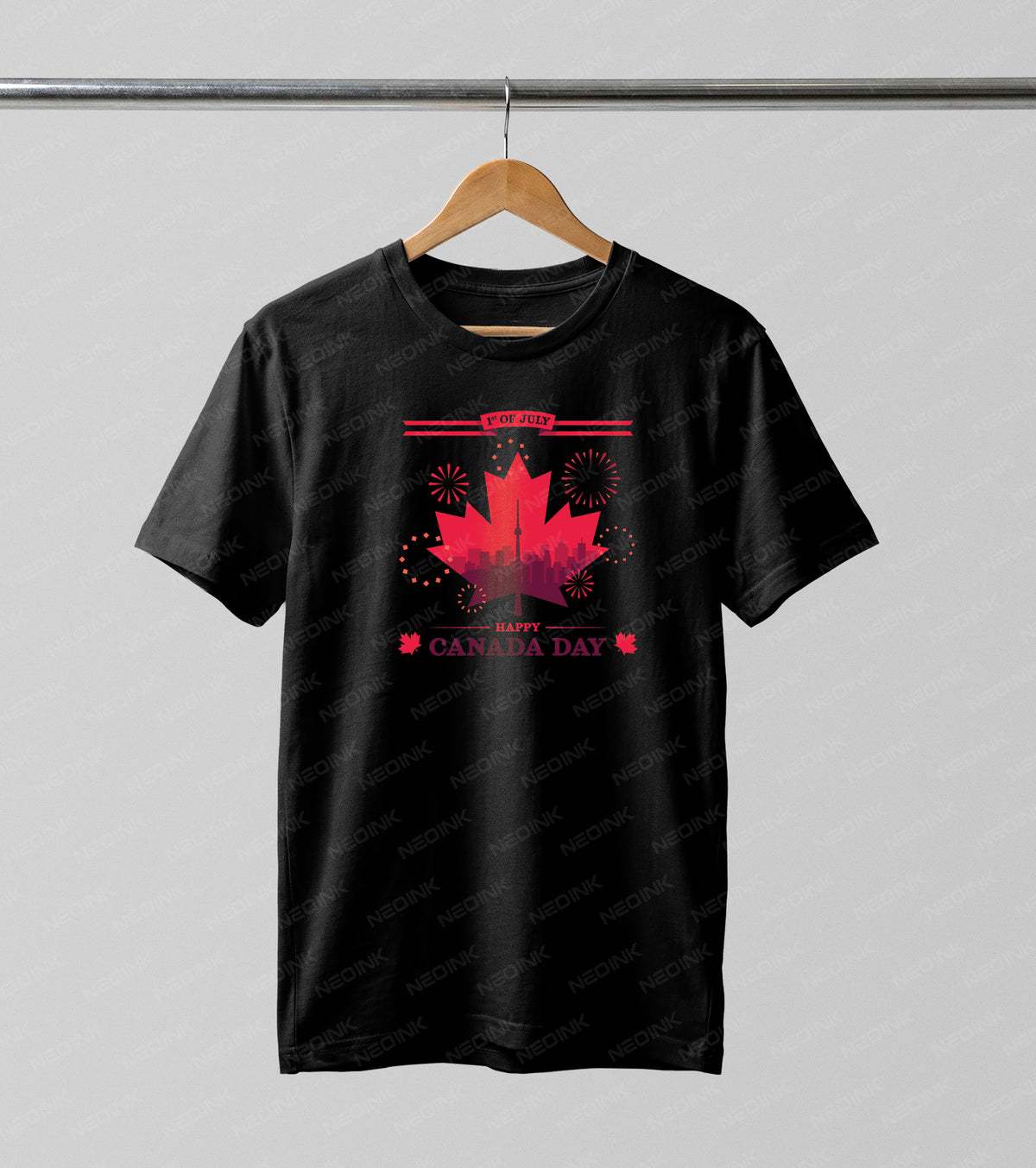 Red maple leaf framing the pink Toronto city skyline and fireworks, supplied as striking DTF transfers completely ready to print on dark clothing.