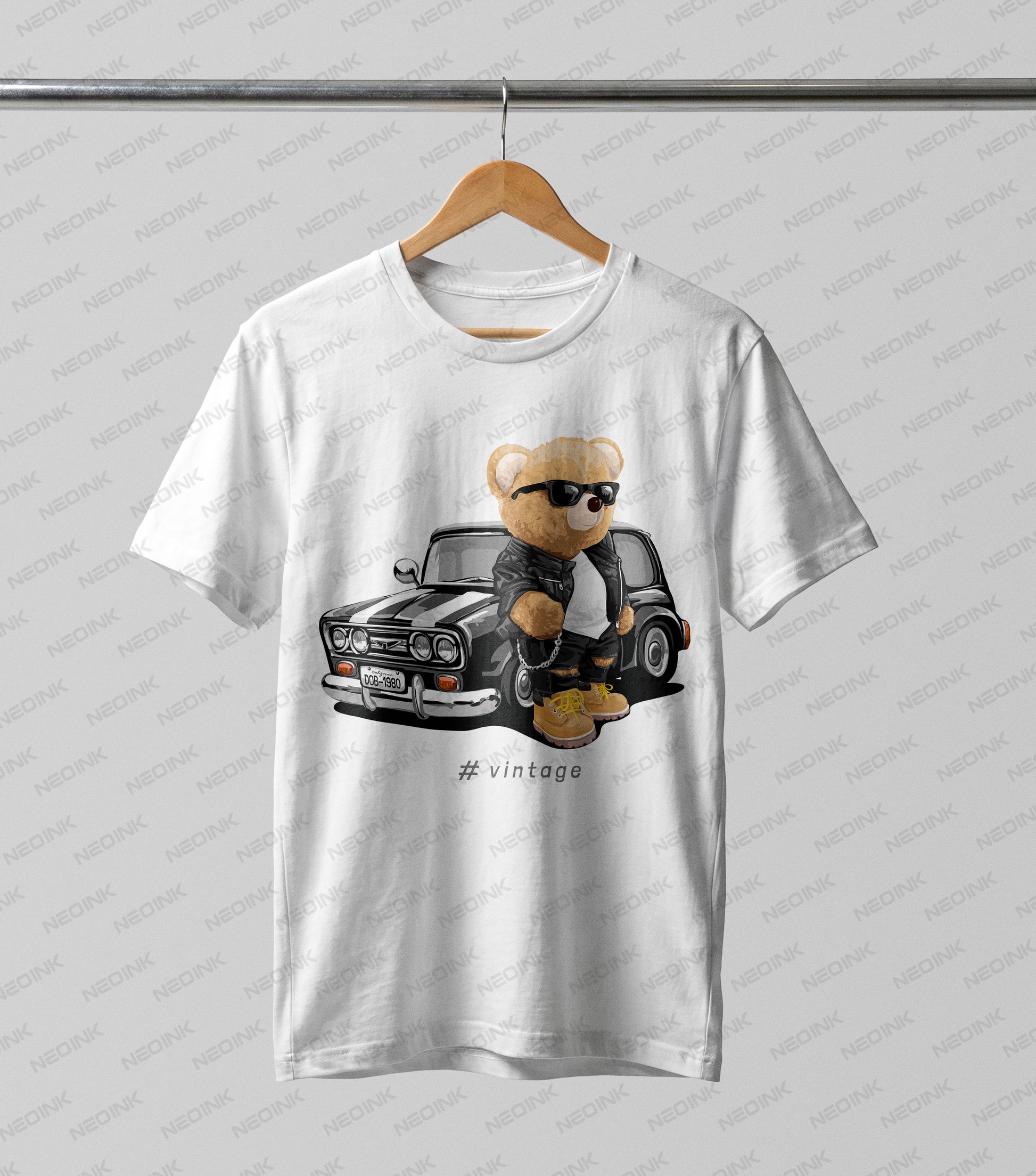 Cool teddy bear in a leather jacket standing next to a vintage black muscle car, provided as vivid DTF transfers ready to print on casual wear.
